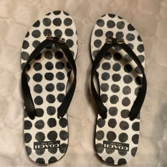 Coach flip flops in white and black polka dots straps adorned with silver bows. - Picture 6 of 6